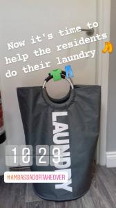 Photo of a laundry basket. Text over the image explains that it is time to support the residents to do their laundry.
